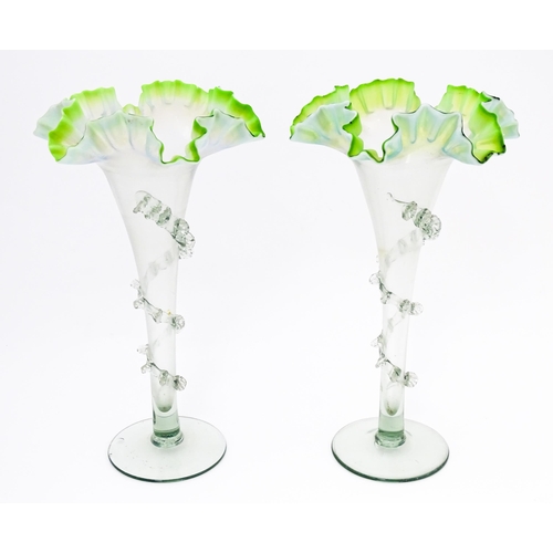 230 - A pair of art glass vases with flared rims and prunt detail. Approx. 10 1/4