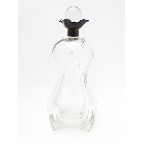 249 - A Victorian shaped glass decanter with trail detail, with silver collar hallmarked London 1896, make... 