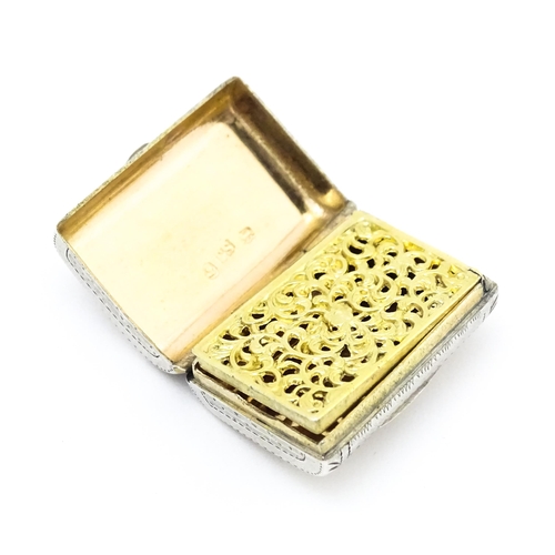 380 - A silver vinaigrette of purse form with engraved floral detail and gilded interior   hallmarked Birm... 