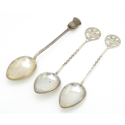 388 - A pair of silver Scottish souvenir teaspoons the handles with thistle detail and titled Braemar, hal... 