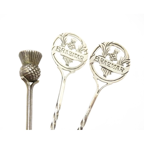 388 - A pair of silver Scottish souvenir teaspoons the handles with thistle detail and titled Braemar, hal... 