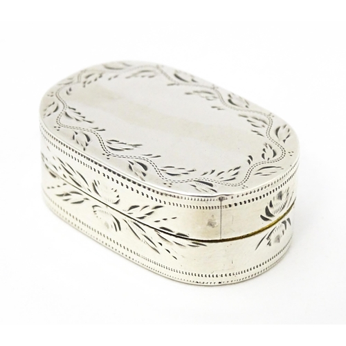 459 - A silver vinaigrette of oval form with engraved foliate detail, hallmarked Birmingham 1799, maker Co... 