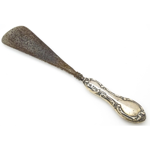 504 - A silver handled shoehorn hallmarked Birmingham 1911 maker W J Myatt & Co  together with manicure to... 