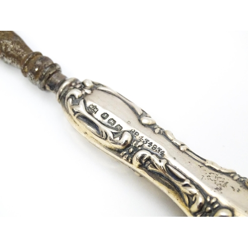 504 - A silver handled shoehorn hallmarked Birmingham 1911 maker W J Myatt & Co  together with manicure to... 