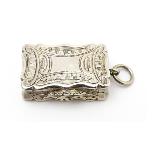 507 - A small Victorian silver vinaigrette with engraved decoration and gilded interior, hallmarked Birmin... 