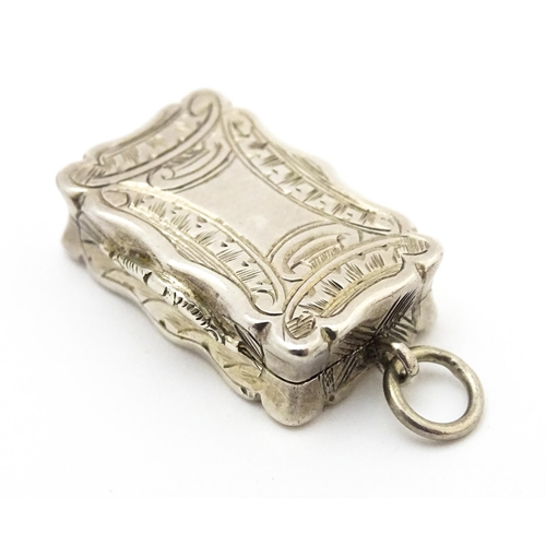 507 - A small Victorian silver vinaigrette with engraved decoration and gilded interior, hallmarked Birmin... 