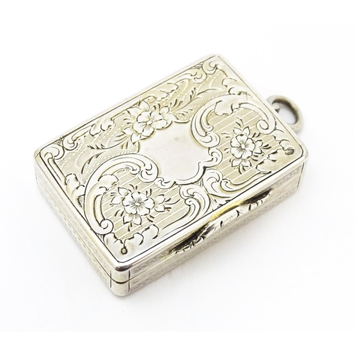 523 - A Victorian silver vinaigrette with engraved floral decoration hallmarked Birmingham 1857, maker Ast... 