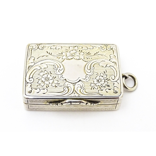 523 - A Victorian silver vinaigrette with engraved floral decoration hallmarked Birmingham 1857, maker Ast... 