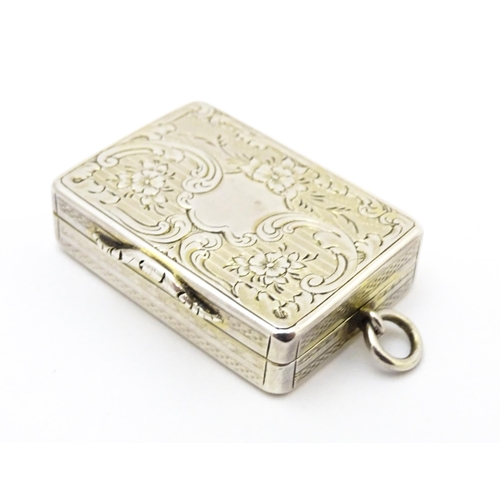 523 - A Victorian silver vinaigrette with engraved floral decoration hallmarked Birmingham 1857, maker Ast... 