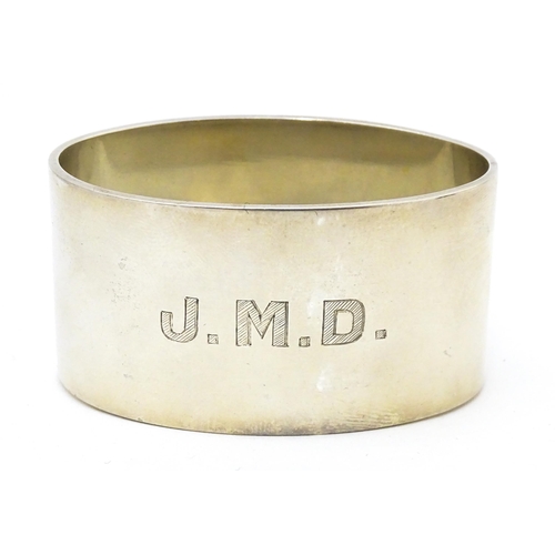 526 - A silver napkin ring of oval form, hallmarked Birmingham 1942, maker J B Chatterley & Sons Ltd.