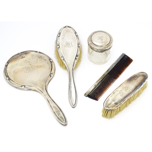 538 - Assorted dressing table items comprising silver backed hand mirror, brush and comb hallmarked Birmin... 