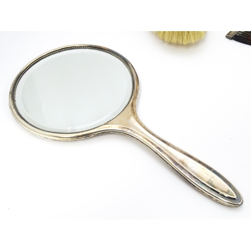 538 - Assorted dressing table items comprising silver backed hand mirror, brush and comb hallmarked Birmin... 