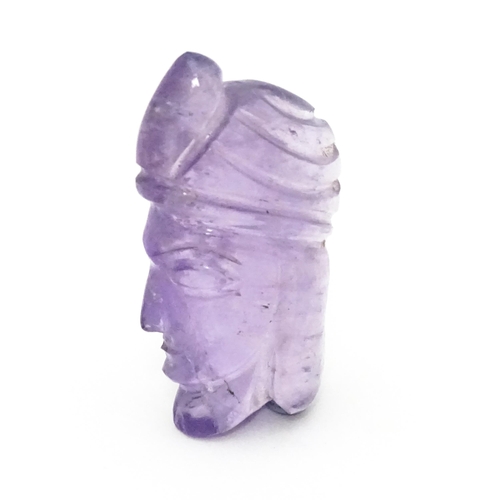 728 - An amethyst intaglio carved to form the head in profile of a man wearing a turban. Approx 1