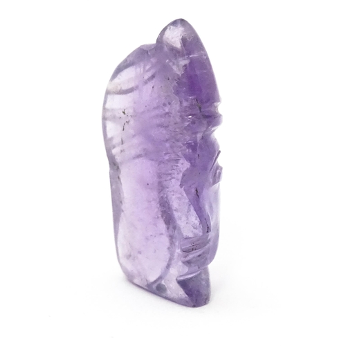 728 - An amethyst intaglio carved to form the head in profile of a man wearing a turban. Approx 1