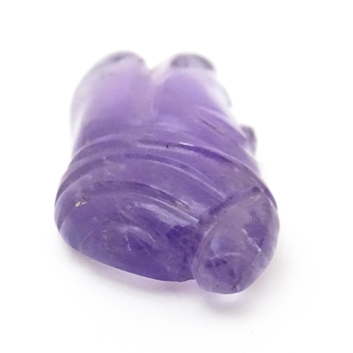 728 - An amethyst intaglio carved to form the head in profile of a man wearing a turban. Approx 1