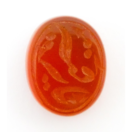 730 - A carnelian stone with Persian style script detail. Unmounted. 3/4