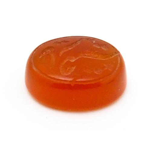 730 - A carnelian stone with Persian style script detail. Unmounted. 3/4