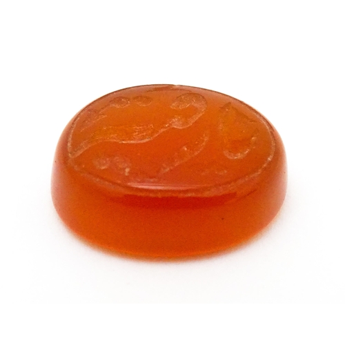 730 - A carnelian stone with Persian style script detail. Unmounted. 3/4