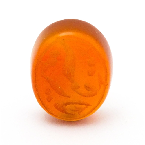 730 - A carnelian stone with Persian style script detail. Unmounted. 3/4