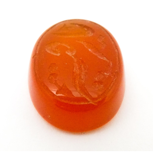 730 - A carnelian stone with Persian style script detail. Unmounted. 3/4