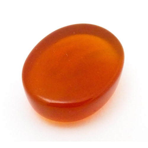 730 - A carnelian stone with Persian style script detail. Unmounted. 3/4