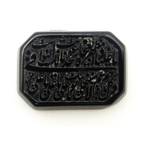 732 - A dark hardstone with Persian style script. Approx 1