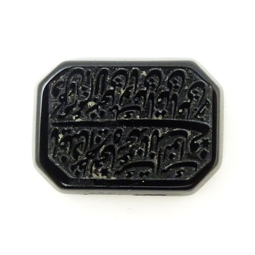 732 - A dark hardstone with Persian style script. Approx 1