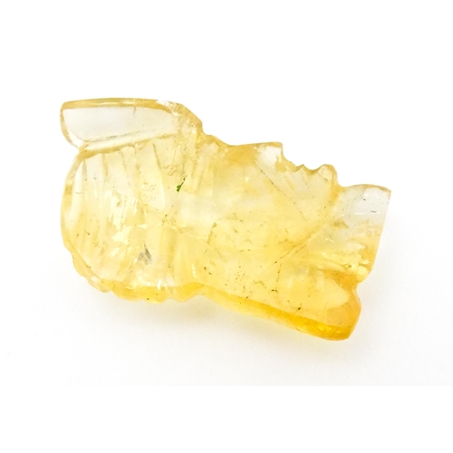 737 - A citrine intaglio carved to form the head in profile of a man wearing a turban. Approx 1