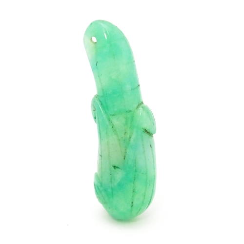 739 - An Oriental carved jade pendant modelled as corn on the cob. 1 3/4