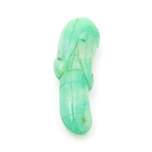 739 - An Oriental carved jade pendant modelled as corn on the cob. 1 3/4