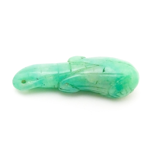 739 - An Oriental carved jade pendant modelled as corn on the cob. 1 3/4