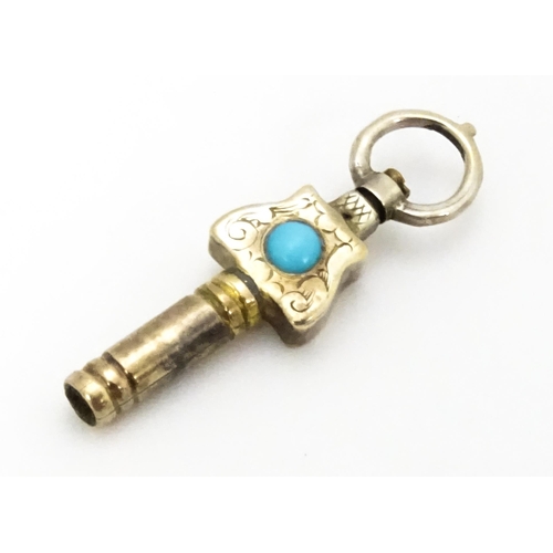 775 - A gilt metal pocket watch key set with turquoise cabochon. Approx. 1