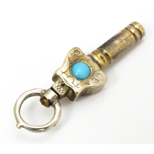 775 - A gilt metal pocket watch key set with turquoise cabochon. Approx. 1