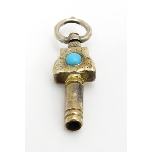 775 - A gilt metal pocket watch key set with turquoise cabochon. Approx. 1