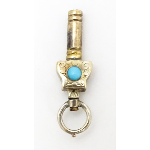 775 - A gilt metal pocket watch key set with turquoise cabochon. Approx. 1