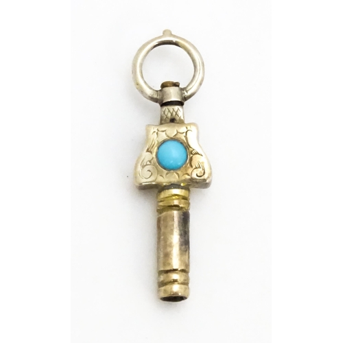 775 - A gilt metal pocket watch key set with turquoise cabochon. Approx. 1