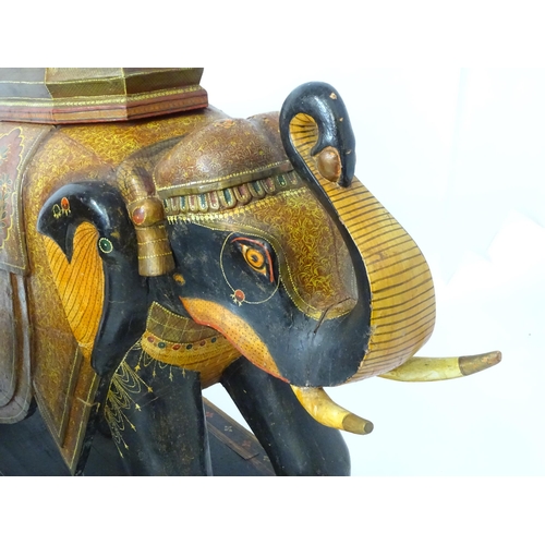 1304 - Two large Kashmir wooden models of elephants with polychrome decoration raised on rectangular bases.... 