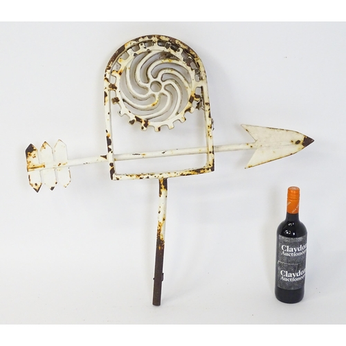 1310 - A 19thC white painted cast iron weather vane with stylised cog decoration. Approx 28