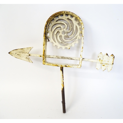 1310 - A 19thC white painted cast iron weather vane with stylised cog decoration. Approx 28