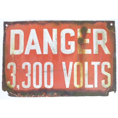 1316 - A mid 20thC enamel warning sign with red ground and white text 'Danger 3,300 Volts'. Approx 18