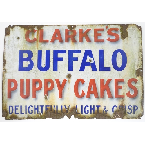 1322 - A 20thC polychrome enamel advertising sign for Clarke's Buffalo Puppy Cakes Delightfully Light & Cri... 