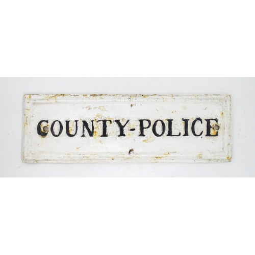 1331 - Local Buckinghamshire Interest: A 20thC monochrome cast sign 'County - Police'. Reputed to have been... 