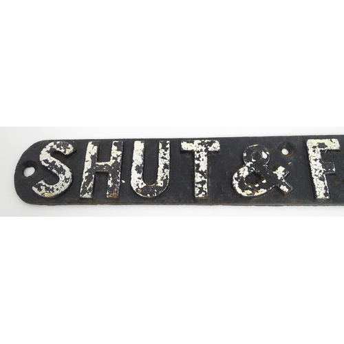 1334 - British Railway Interest: A 20thC cast iron railway sign, 'Shut & Fasten Gate'. Together with a 20th... 