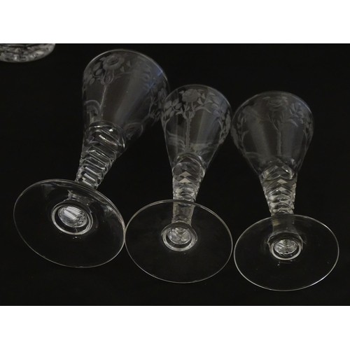 295 - A quantity of various crystal drinking glasses with cut decoration and etched rose detail, to includ... 