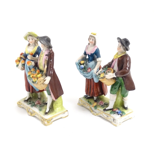 186 - Two Italian Capodimonte figure groups modelled as fruit gatherers with baskets of apples. Approx. 4