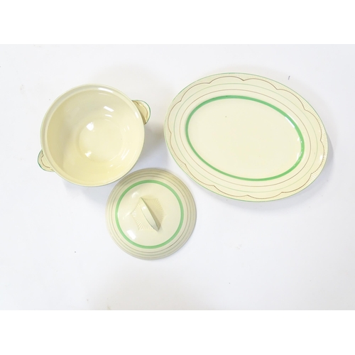 221 - A quantity of Clarice Cliff Art Deco dinner wares with green and gilt banded detail to include turee... 