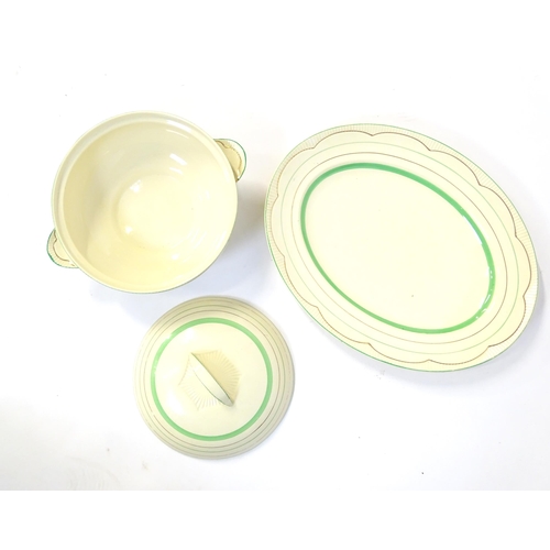 221 - A quantity of Clarice Cliff Art Deco dinner wares with green and gilt banded detail to include turee... 