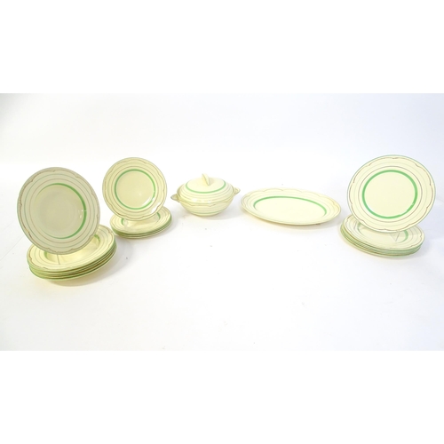 221 - A quantity of Clarice Cliff Art Deco dinner wares with green and gilt banded detail to include turee... 