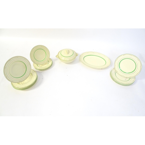 221 - A quantity of Clarice Cliff Art Deco dinner wares with green and gilt banded detail to include turee... 