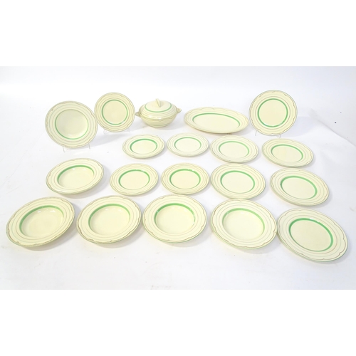 221 - A quantity of Clarice Cliff Art Deco dinner wares with green and gilt banded detail to include turee... 